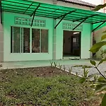A Two-Bedroom Home With Natural Light And Green Environment